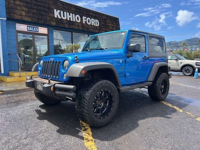2015 Jeep Wrangler 4WD 2dr Sport in Hydro Blue Pearl Coat — front three-quarter view