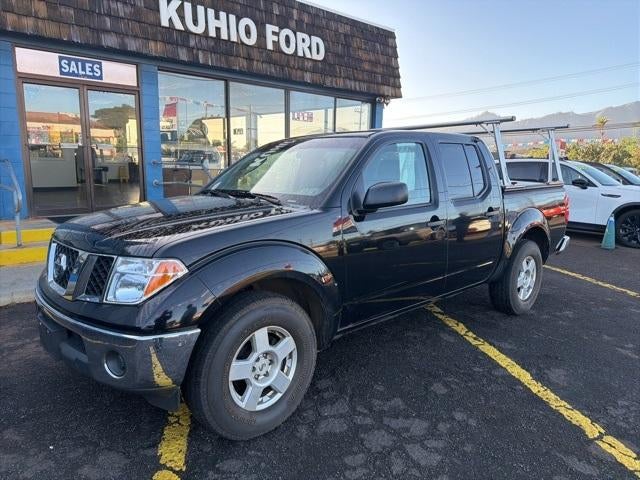 2006 Nissan Frontier 4WD Crew Cab V6 Automatic SE in Storm Gray — front three-quarter view